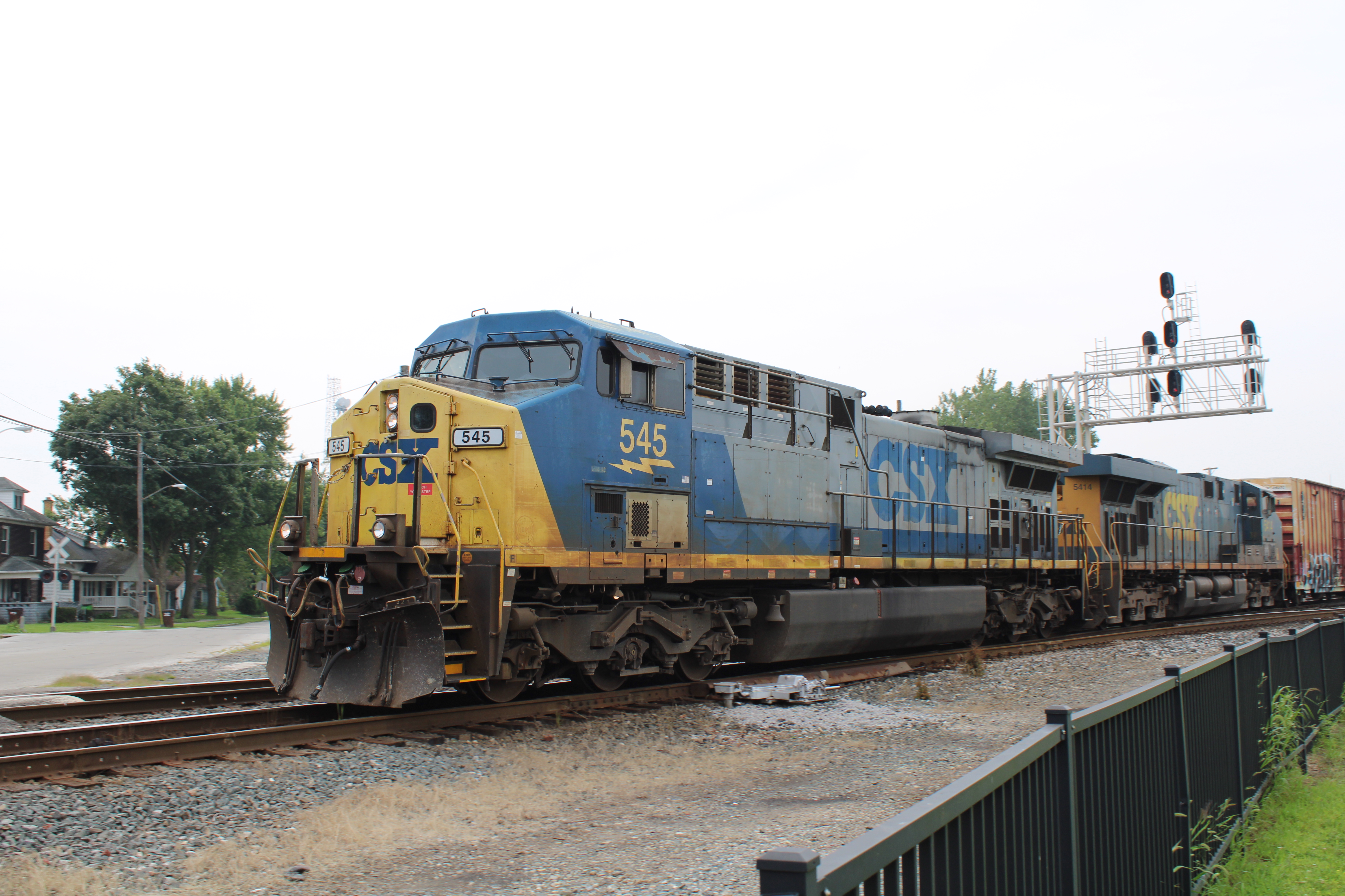 CSX locomotives pull a boxcar
