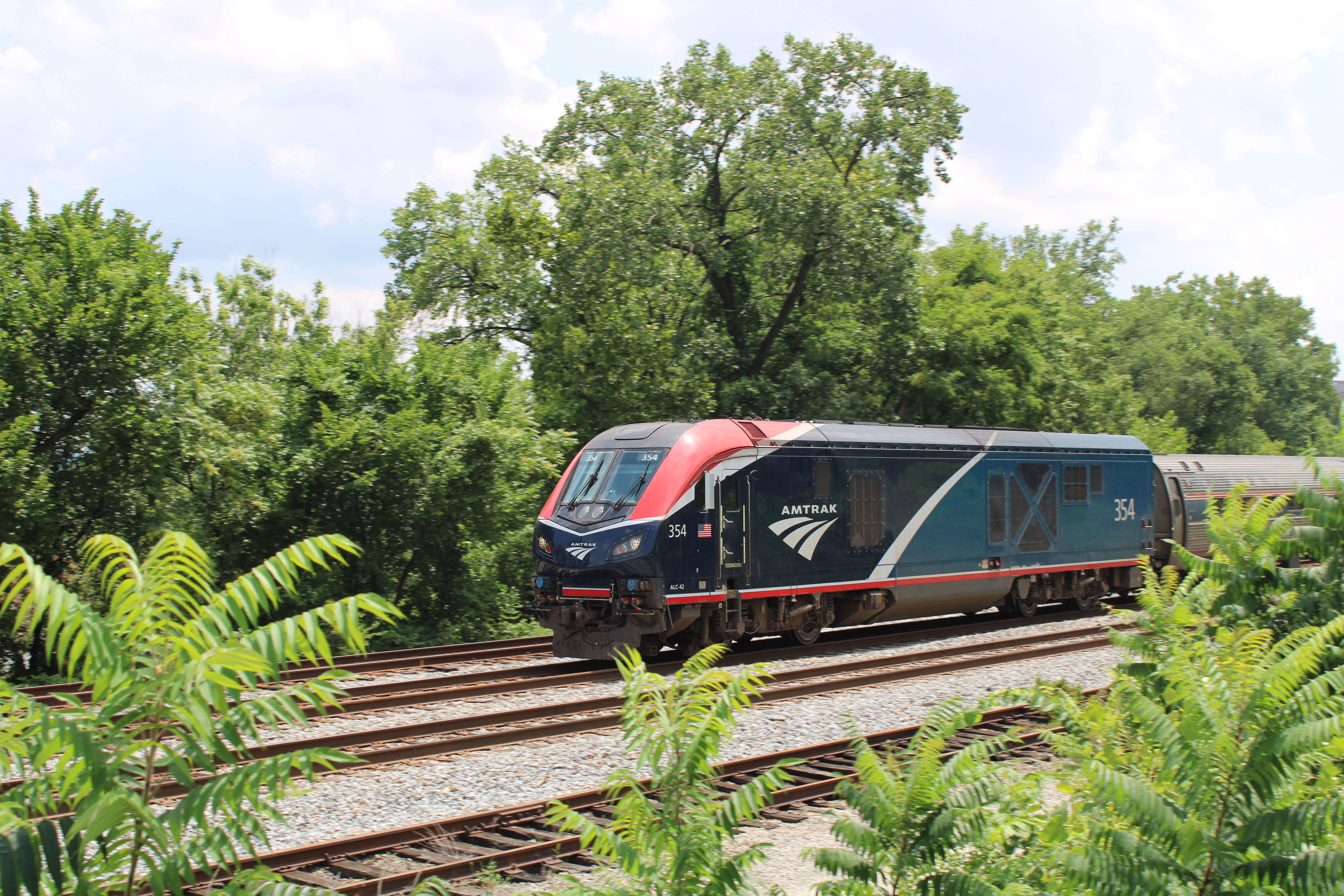 A new Amtrak locomotive on a sunny day